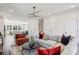 Spacious living room featuring sleek lighting, open floorplan, and hardwood floors at 101 Mission Se Way # 101, Atlanta, GA 30315