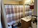 Bathroom with a striped shower curtain, vanity, and standard toilet at 2195 Wilson Rd, Conyers, GA 30012