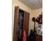Bedroom closet featuring bifold doors revealing ample storage space for clothes and accessories at 2195 Wilson Rd, Conyers, GA 30012