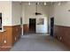 The living room has wooden paneled walls, carpeted flooring, a ceiling fan, and recessed lighting at 2195 Wilson Rd, Conyers, GA 30012