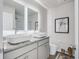 Modern bathroom with dual vessel sinks, granite countertops, and illuminated mirrors at 235 Ivey Ter, Temple, GA 30179