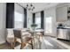 Cozy dining area with a stylish banquette seating, elegant lighting, and modern decor at 235 Ivey Ter, Temple, GA 30179