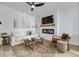 Modern living room with a decorative accent wall, stylish furniture, and an electric fireplace at 235 Ivey Ter, Temple, GA 30179