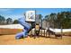 Community playground featuring a blue slide and climbing structure for hours of outdoor fun and recreation at 235 Ivey Ter, Temple, GA 30179