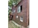 Home exterior showing brickwork, windows, and a small balcony, combining traditional style with outdoor space at 240 Mathewson Sw, Atlanta, GA 30314