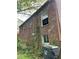 Brick exterior of a home with windows and greenery, offering a glimpse of the property's potential at 240 Mathewson Sw, Atlanta, GA 30314