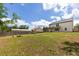 Large backyard with a playset, fire pit, and ample green space, ideal for outdoor activities at 446 Noblewood Dr, Mcdonough, GA 30252