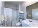 Bright bathroom with a shower, vanity, and a large mirror at 446 Noblewood Dr, Mcdonough, GA 30252