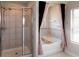 Bathroom featuring a soaking tub, glass-enclosed shower and modern decor at 446 Noblewood Dr, Mcdonough, GA 30252