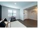 Well lit bedroom with hardwood floors, window and adjacent to the home's entrance at 446 Noblewood Dr, Mcdonough, GA 30252