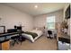 Cozy bedroom features carpet floors, large window, and plenty of space for desk and musical keyboard at 446 Noblewood Dr, Mcdonough, GA 30252