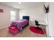 bedroom featuring a bed, desk, and TV mounted on the wall at 446 Noblewood Dr, Mcdonough, GA 30252