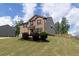 Beautiful brick home with lush landscaping, a two-car garage, and well-maintained front lawn at 446 Noblewood Dr, Mcdonough, GA 30252