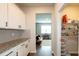 Well-organized kitchen with granite countertops, white cabinets, stainless steel appliances, and walk in pantry at 446 Noblewood Dr, Mcdonough, GA 30252