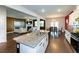 Open concept layout, connecting the kitchen to the living room with a fireplace and hardwood floors at 446 Noblewood Dr, Mcdonough, GA 30252