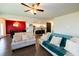 Open layout with combined living room, dining area, and kitchen featuring hardwood floors at 446 Noblewood Dr, Mcdonough, GA 30252