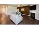 Bright living room with a fireplace, hardwood floors, and a comfortable seating area at 446 Noblewood Dr, Mcdonough, GA 30252