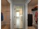 Dual walk-in closets lead to a bathroom, offering abundant storage and convenience at 446 Noblewood Dr, Mcdonough, GA 30252