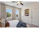 Bright bedroom featuring two windows, neutral walls, and a ceiling fan, creating a comfortable retreat at 103 Mission Se Way # 103, Atlanta, GA 30315