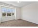 Cozy bedroom with large window offering a scenic view and plush carpeting at 103 Mission Se Way # 103, Atlanta, GA 30315