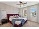 Stylish bedroom featuring a large bed with a unique headboard, decorative pillows, and ample natural light at 103 Mission Se Way # 103, Atlanta, GA 30315