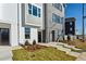 Stylish exterior with grey and white painted brick, manicured lawn at 103 Mission Se Way # 103, Atlanta, GA 30315
