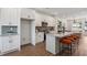 Modern kitchen featuring white cabinets, granite countertops, stainless steel appliances, and seating at the island at 103 Mission Se Way # 103, Atlanta, GA 30315