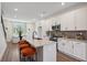 Bright and modern kitchen with granite countertops, stainless steel appliances, and a breakfast bar at 103 Mission Se Way # 103, Atlanta, GA 30315
