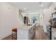 Spacious kitchen featuring granite countertops, stainless appliances, and adjacent dining area at 103 Mission Se Way # 103, Atlanta, GA 30315