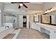 Bright bathroom with walk-in shower, soaking tub, double sink vanity and an open doorway at 2049 Mclain Nw Rd, Acworth, GA 30101