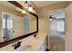 A Primary bathroom features a double sink vanity, hardwood floor, and view to the bedroom at 2049 Mclain Nw Rd, Acworth, GA 30101