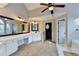 Bright bathroom with vanity, neutral walls, carpeted floors, and door to toilet at 2049 Mclain Nw Rd, Acworth, GA 30101