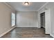 Neutral bedroom with hardwood flooring, a window, and an closet at 2049 Mclain Nw Rd, Acworth, GA 30101