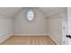 Walk-in closet with shelving and carpet and oval window providing natural light at 2049 Mclain Nw Rd, Acworth, GA 30101