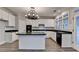 Large kitchen features an island, ample cabinetry, and modern appliances at 2049 Mclain Nw Rd, Acworth, GA 30101