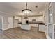 Open kitchen with white cabinets, a center island, and stainless steel appliances are perfect for cooking and entertaining at 2049 Mclain Nw Rd, Acworth, GA 30101