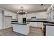 Spacious kitchen with island, white cabinetry and stainless steel appliances at 2049 Mclain Nw Rd, Acworth, GA 30101