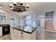 Bright eat-in kitchen boasts a large island, stainless appliances, and views to the living room at 2049 Mclain Nw Rd, Acworth, GA 30101