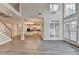 Grand living room flows into the kitchen area with plenty of natural light at 2049 Mclain Nw Rd, Acworth, GA 30101