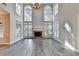 Living area with brick fireplace, large windows, and plenty of natural light at 2049 Mclain Nw Rd, Acworth, GA 30101