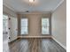 Spacious office with hardwood flooring, two windows, and a doorway at 2049 Mclain Nw Rd, Acworth, GA 30101