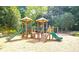 Well-maintained community playground with slides, climbing structures, and a soft ground covering for enjoyment at 2049 Mclain Nw Rd, Acworth, GA 30101