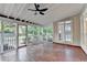 Spacious screened-in porch features ceiling fan and backyard views at 2049 Mclain Nw Rd, Acworth, GA 30101