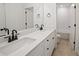 Bathroom featuring a double vanity, white cabinets, and modern fixtures at 2438 Whites Rdg, Decatur, GA 30034