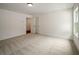 Bright bedroom with neutral carpet, white trim, and a large window for lots of natural light at 2438 Whites Rdg, Decatur, GA 30034