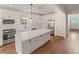 Bright kitchen with white cabinets, a large center island, and stainless steel appliances at 2438 Whites Rdg, Decatur, GA 30034