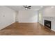 Spacious living room with hardwood floors, a fireplace, and ample natural light at 2438 Whites Rdg, Decatur, GA 30034