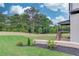 Spacious backyard featuring a wood fence, patio, and landscaping, perfect for outdoor gatherings and relaxation at 3203 Bold Springs Rd, Dacula, GA 30011