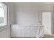 Bathroom featuring a window, awaiting final touches, with white trim and natural light, offering a clean and modern aesthetic at 3203 Bold Springs Rd, Dacula, GA 30011