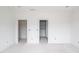 Bedroom featuring two doorways and recessed lighting, offering a spacious layout with neutral tones awaiting personal touches at 3203 Bold Springs Rd, Dacula, GA 30011